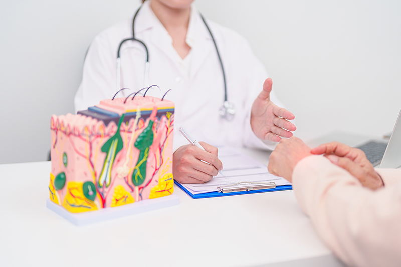 A dermatologist providing a consultation