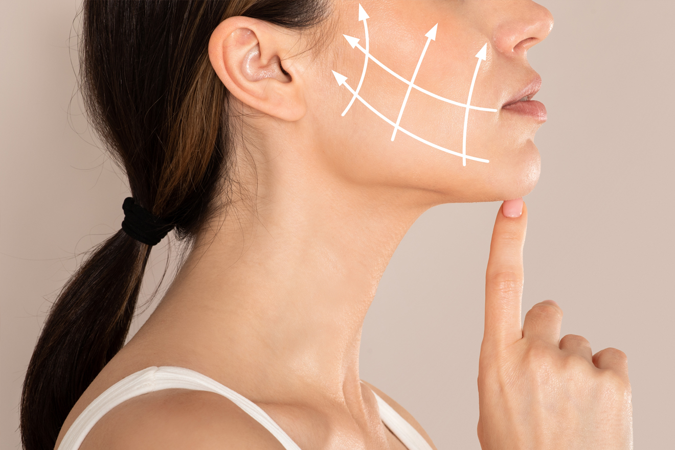 A woman contemplating skin tightening procedures